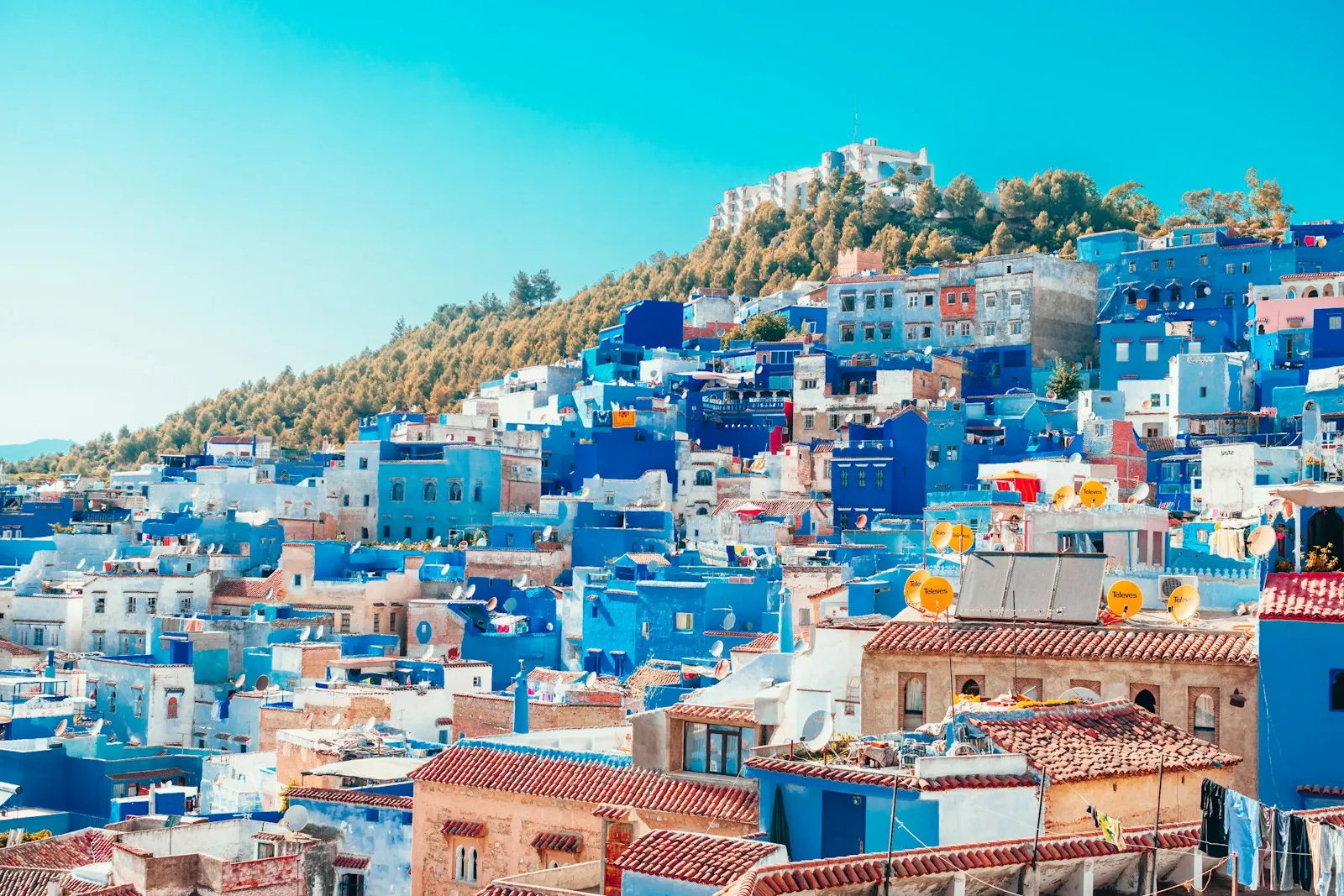 Blue and white painted houses on the cliff