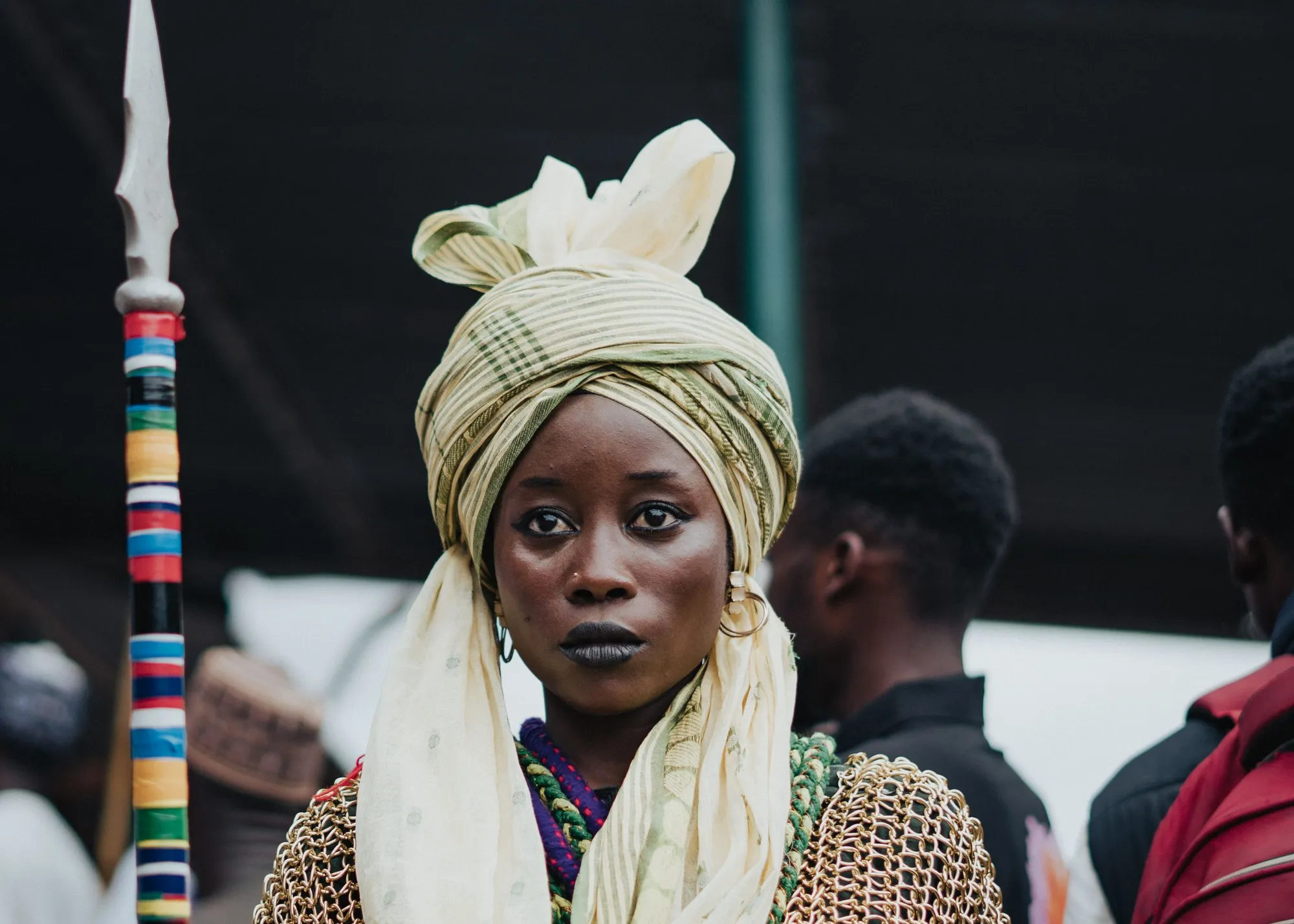 A member in traditional attire at a cultural festival