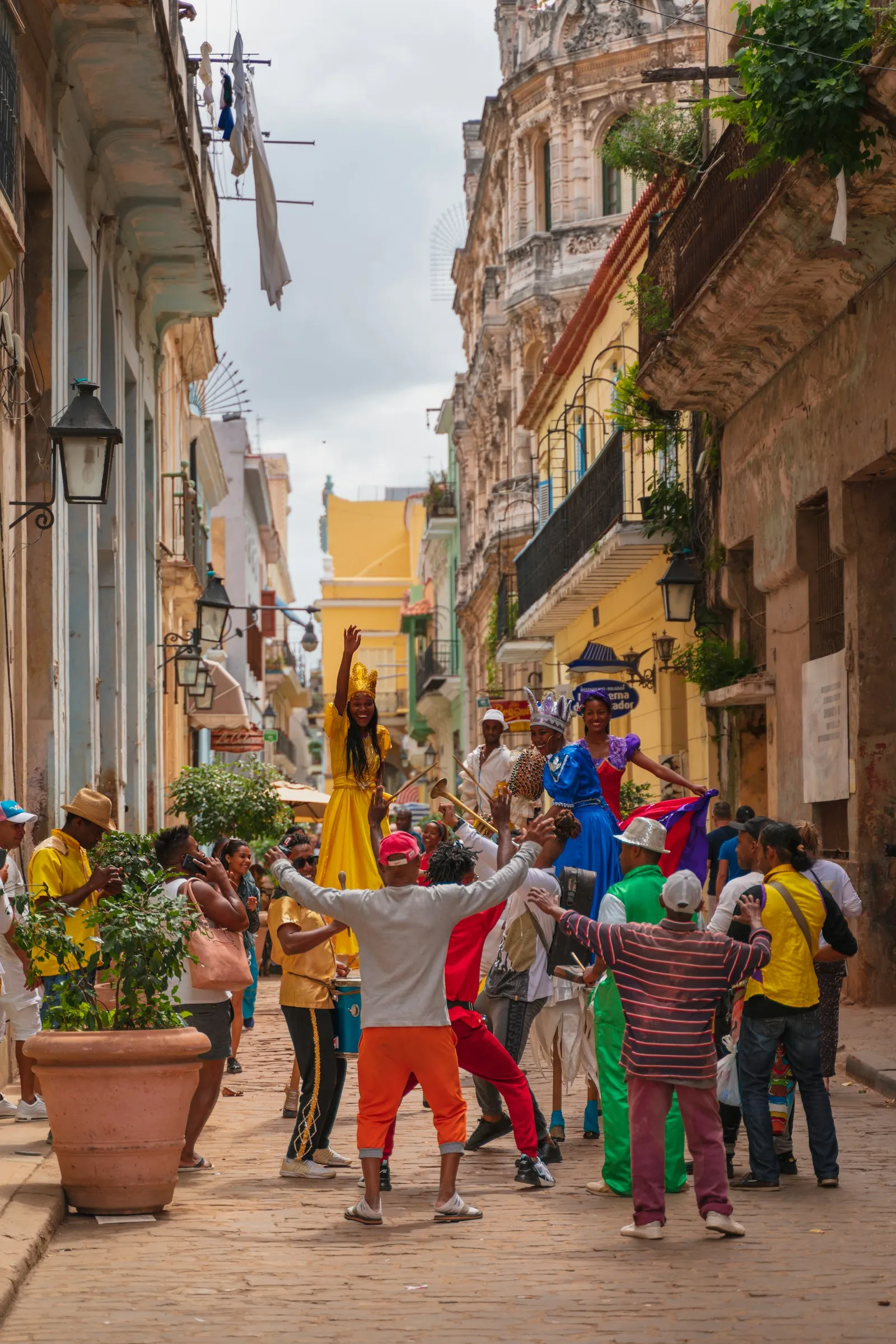 People in traditional dress walking on the street